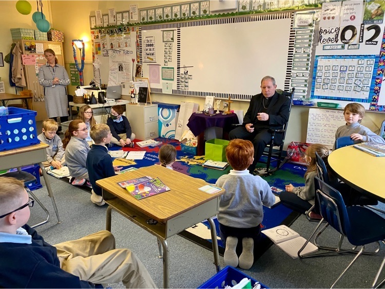 Bishop Gruss visits with our students . 